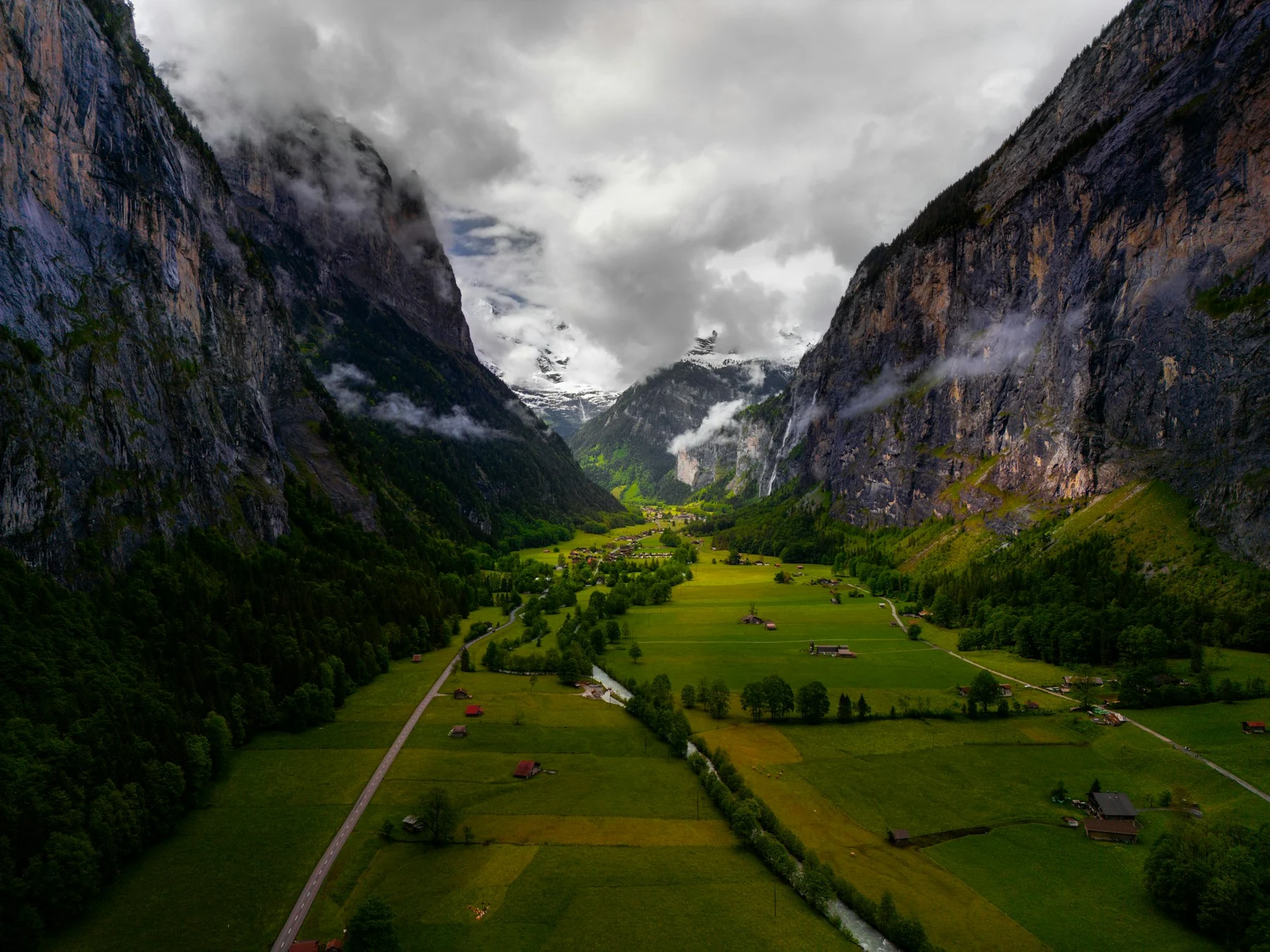 Traditional houses and green fields in the Lauterbrunnen valley, Switzerland